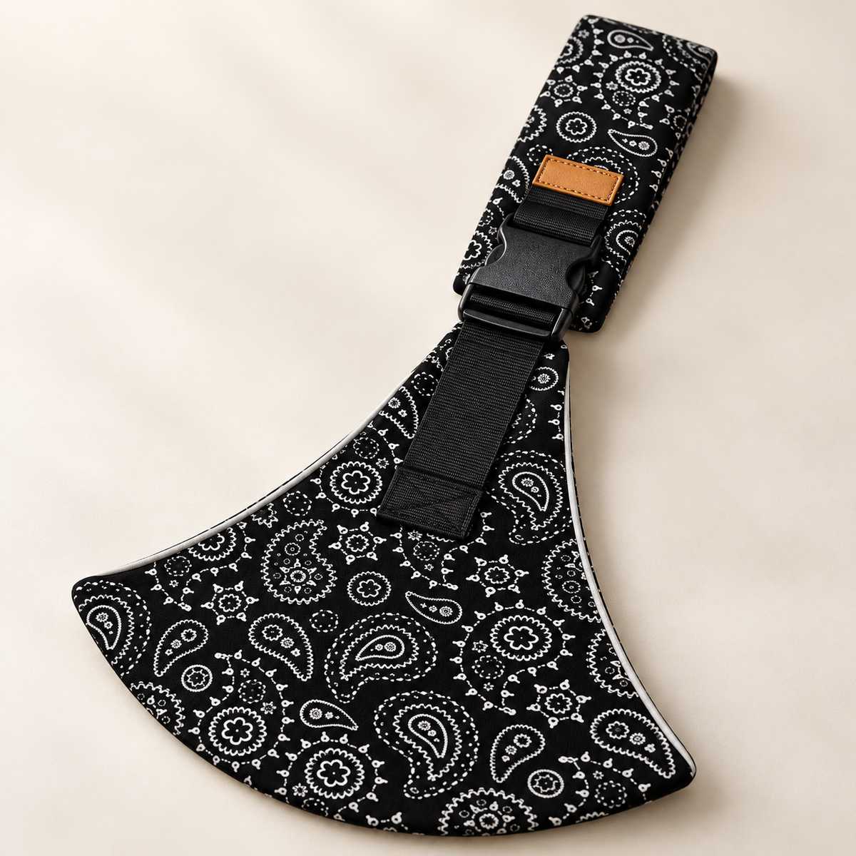 Close-up of buckle, strap and paisley fabric on the Black Paisley sling