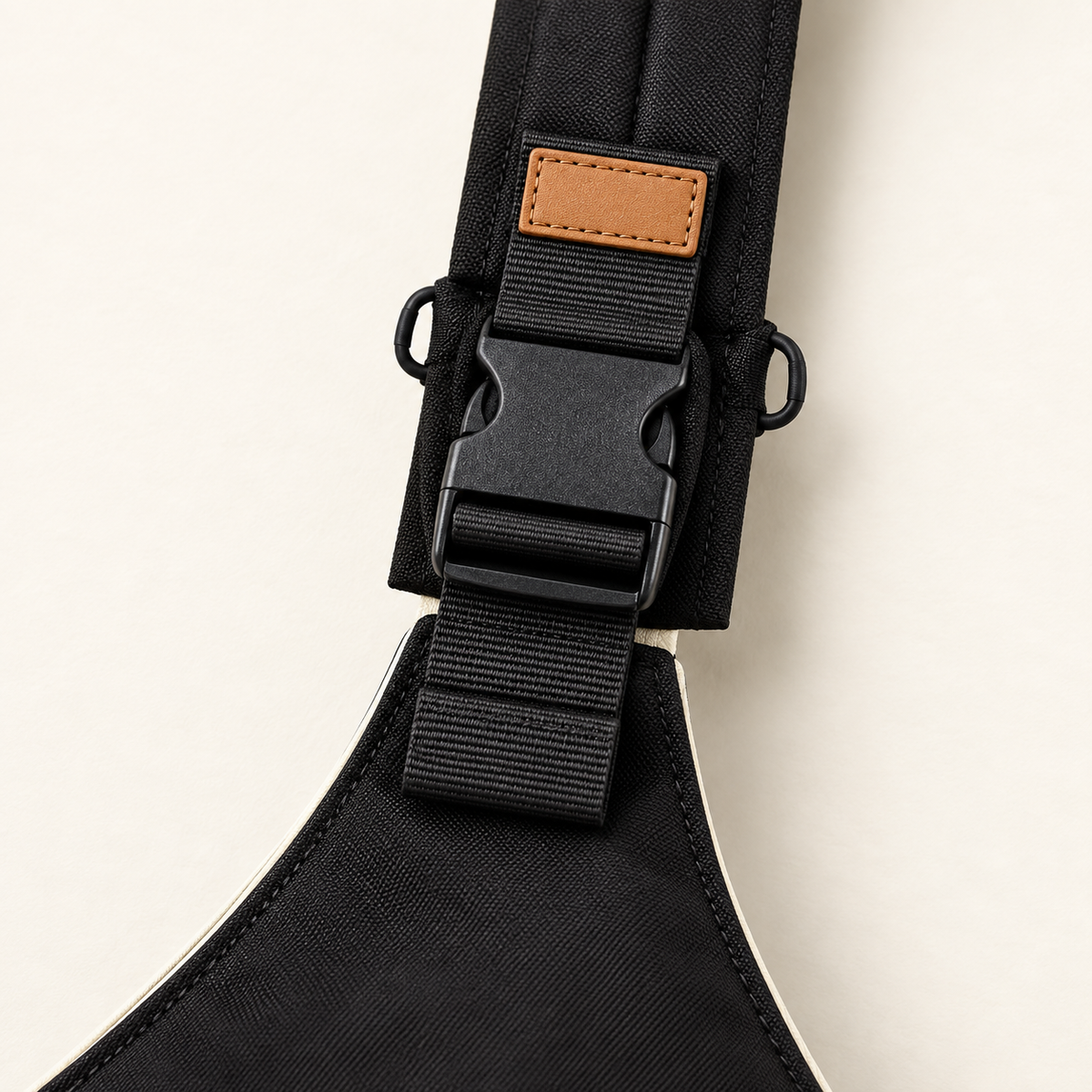 Close-up of black woven sling fabric, adjustable webbing and buckle