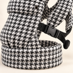 Close-up of buckle, waistband and houndstooth fabric on the Née carrier