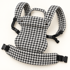 Grand Houndstooth baby carrier opened to show straps and padded waistband