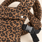 Leopard Print baby carrier fabric, snap, buckle, and stitching detail