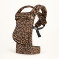 Leopard Print ergonomic baby carrier in warm camel brown, studio product view