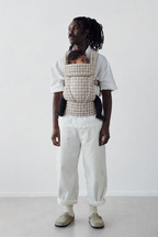 Father and baby in the Née Khaki Houndstooth ergonomic baby carrier, front portrait