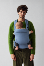 Father and baby in the Née Powder Blue ergonomic baby carrier, front portrait