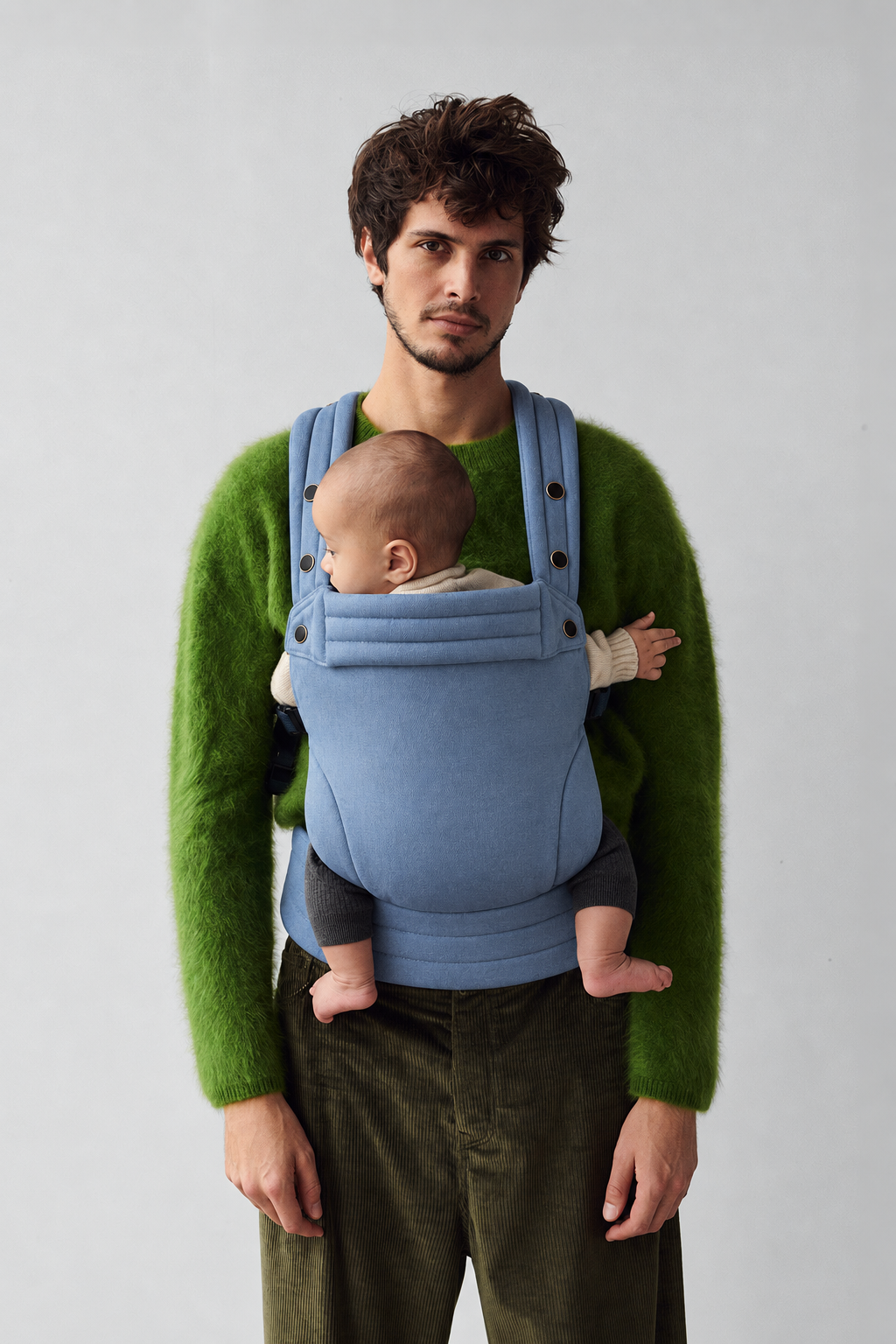 Father and baby in the Née Powder Blue ergonomic baby carrier, front portrait