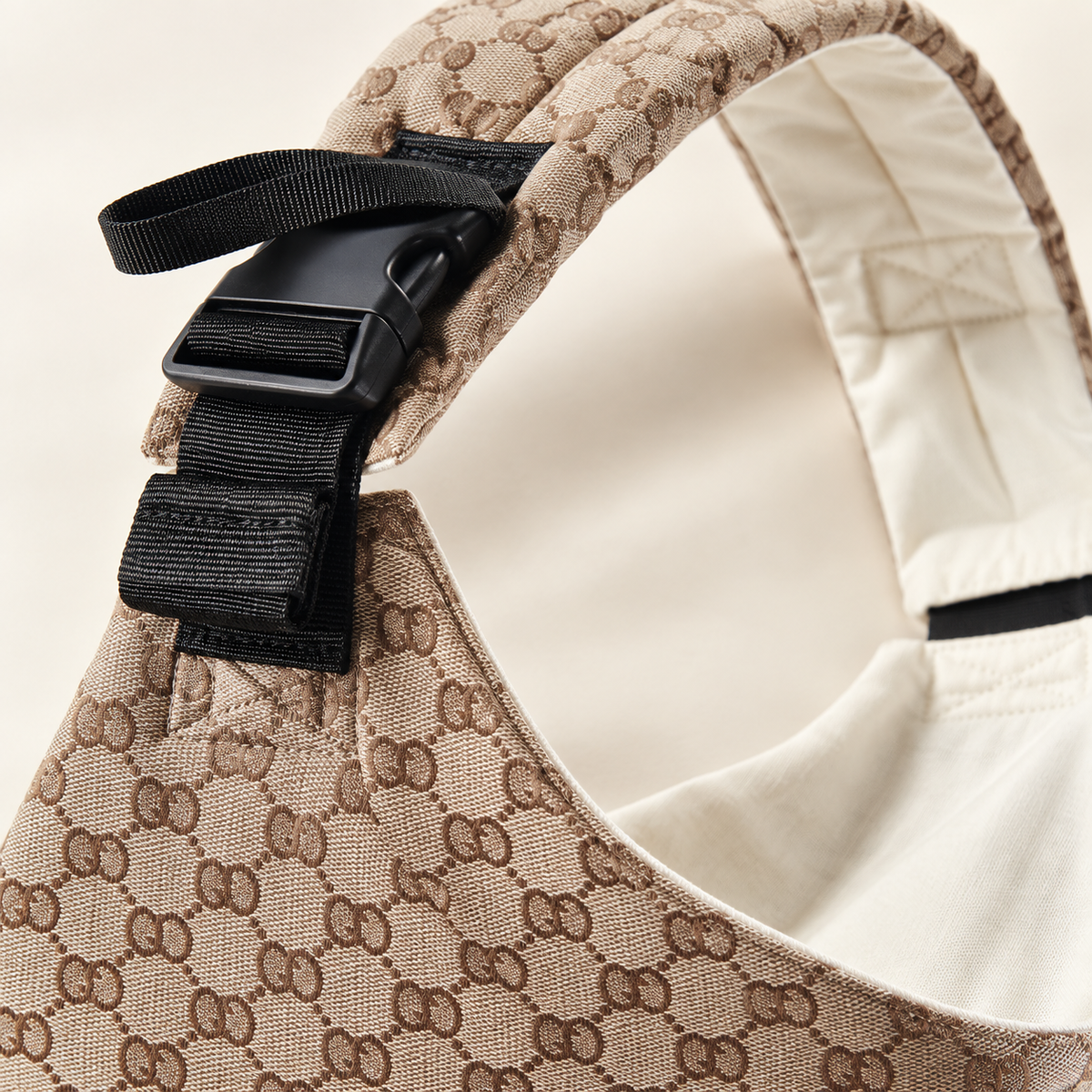 Close-up of buckle, strap and woven fabric on the Sand Leopard baby sling